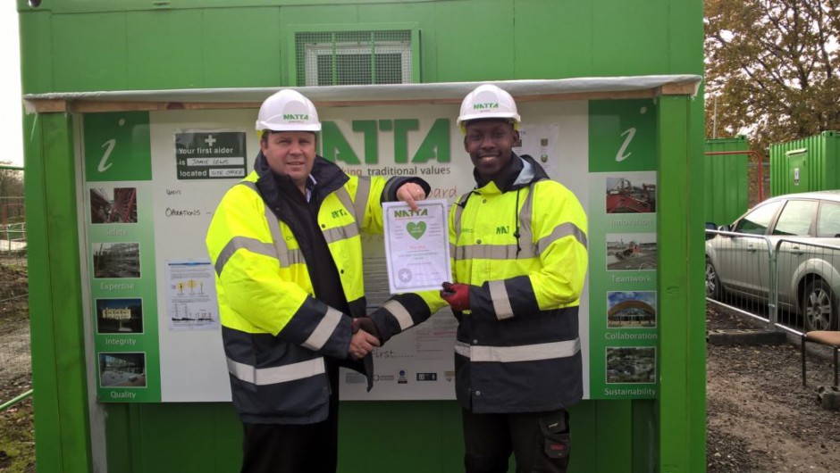 From left to right: Morris Micah being presented his award for Quality by John Bole