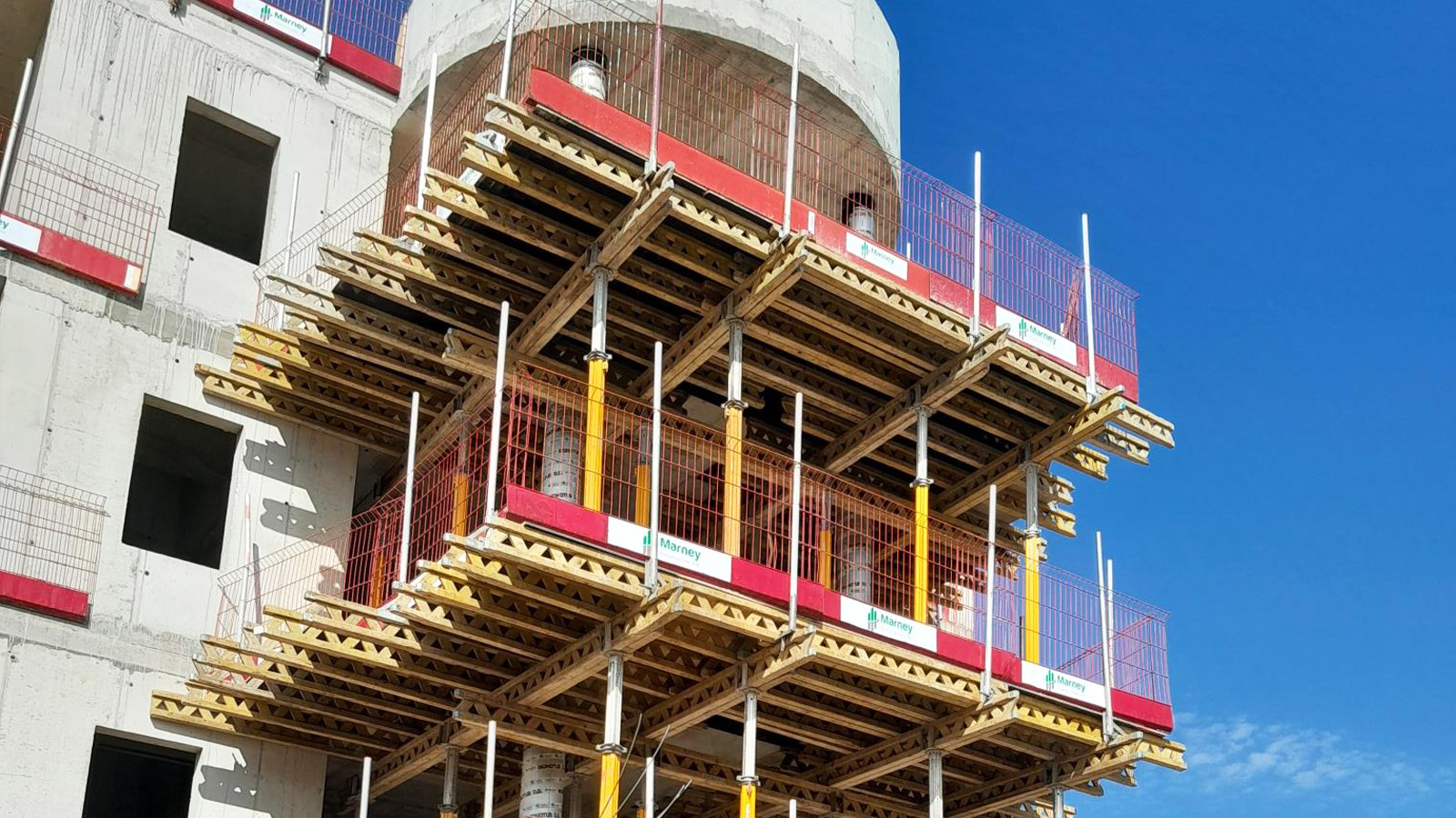 Multi-storey concrete care home building under construction.